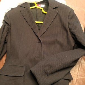 Black cropped fitted jacket...back belt adjusts.